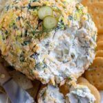 This is a Dill Pickle cheese ball recipe. It is made with cream cheese, dill pickles, and seasonings. It is perfect for a party or snack.